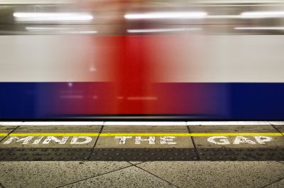 Underground train racing through a station